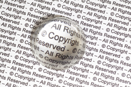 Copyright text viewed with magnifying glass